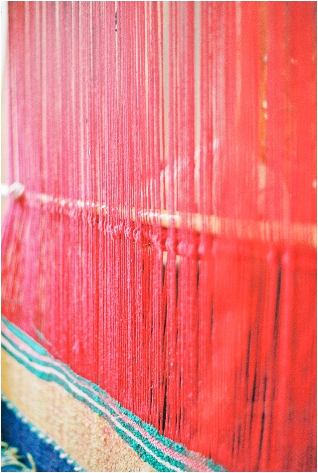 Wool weaving for making carpets in Morocco