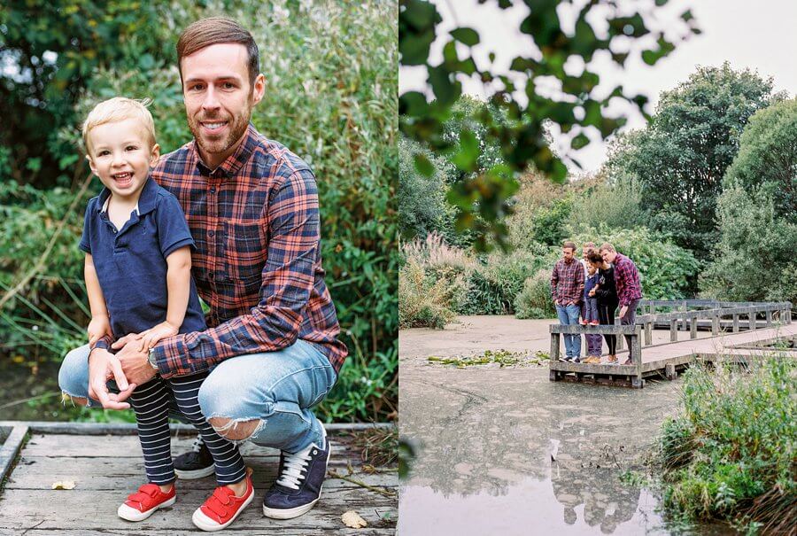 Two images, one with adult in check shirt and child in blue smiling. One with whole family in the distance looking at a pond | Family Woodland Shoot